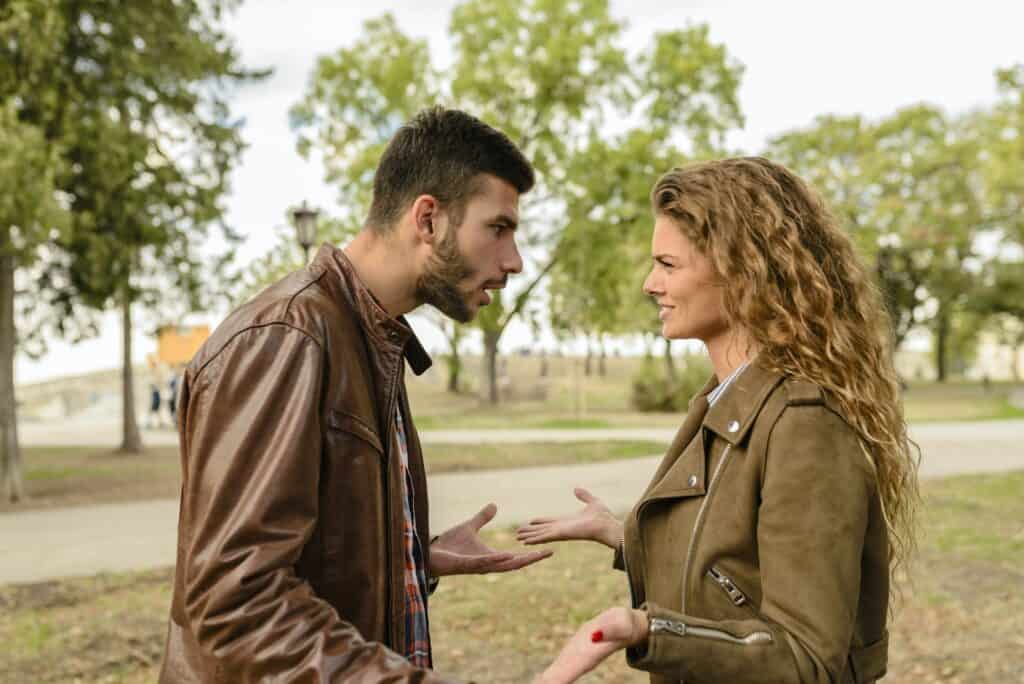 Man And Woman Wearing Brown Leather Jackets is wishing someone to die a sin